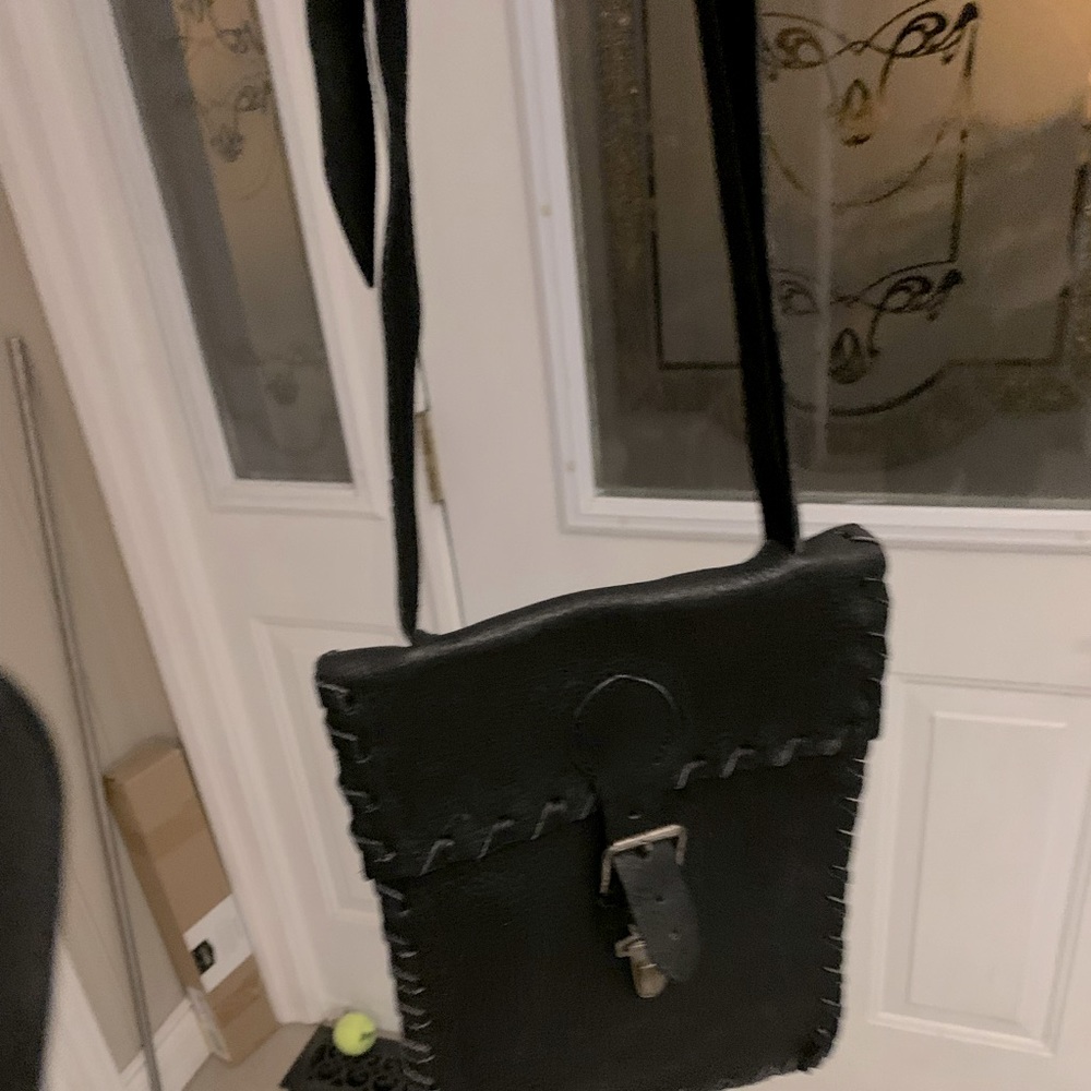 Handcrafted leather satchel body cross bag.